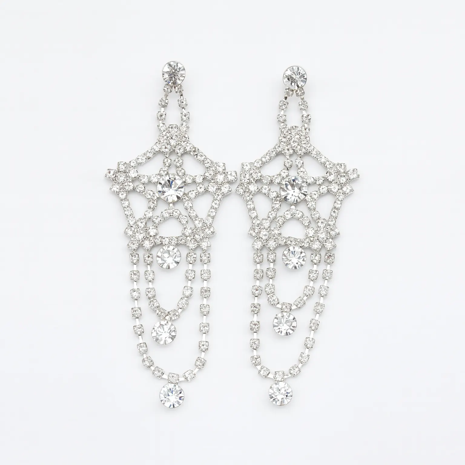 Aros largos de cristales Strass , diseños de estrella. Par de aros largos de Strass color cristal (transparente) de 9 cm, estilo candelabro o lágrima, ideales para danza árabe, oriental, tribal o espectáculos.